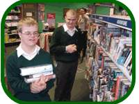 Pictures of students Stacking books in a public library for World of Work